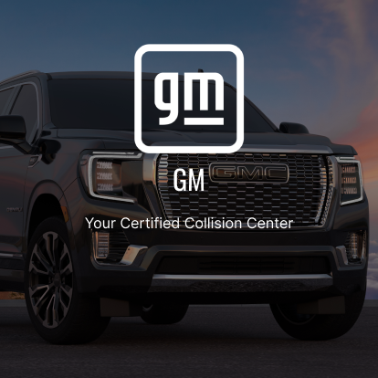 A picture of the front end of a truck with gm logo.