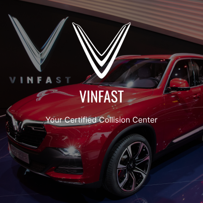 A red car parked in front of the logo for vinfast.